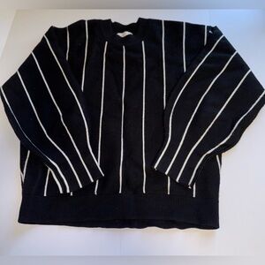 All:row woman’s black and white striped sweater